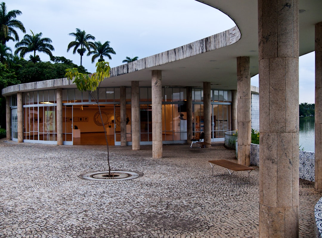 a building with columns and a clock on the outside