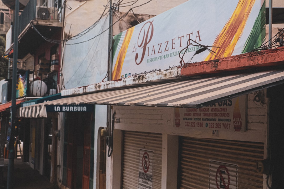 A piazza restaurant is visible along a closed street.