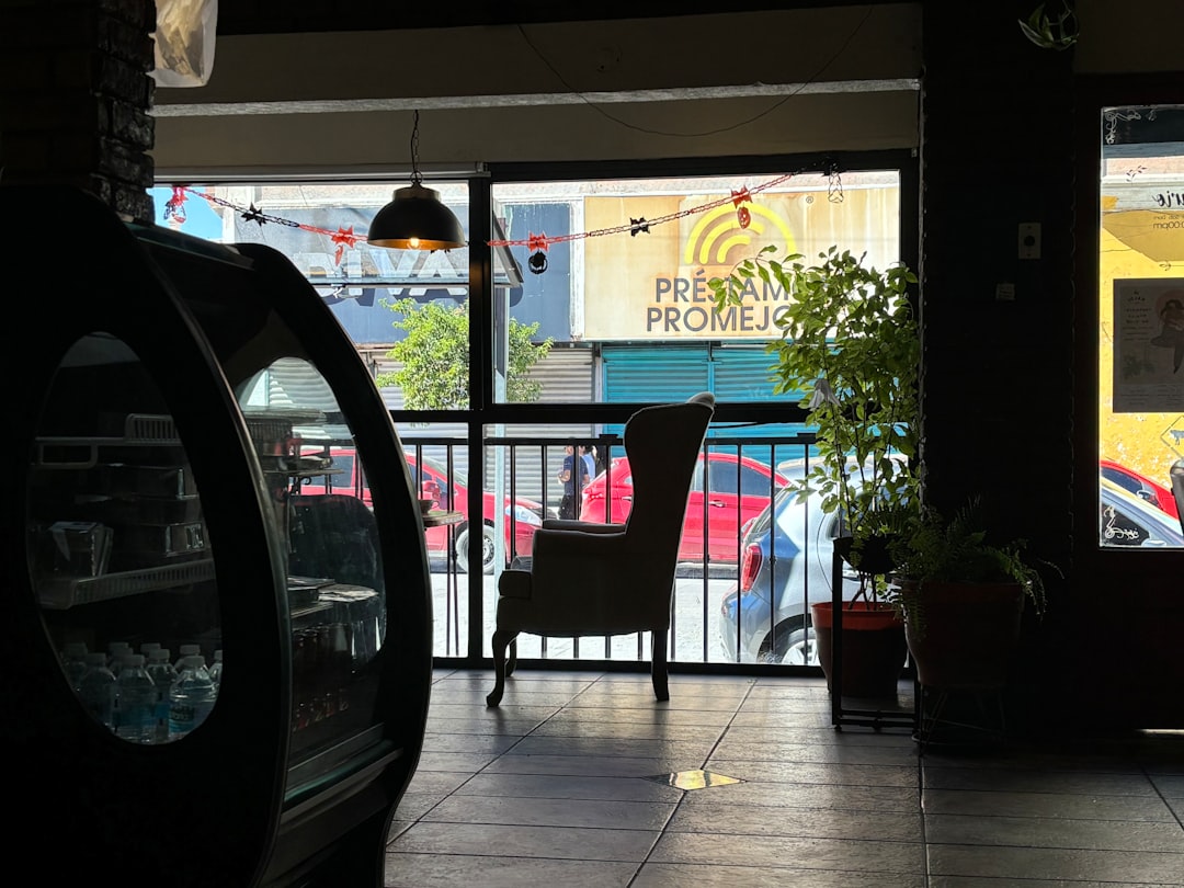 a restaurant with a view of a parking lot