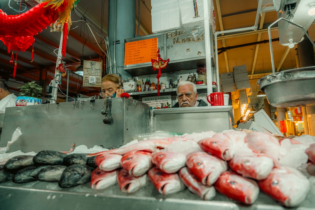 Fish are displayed at a market stall.