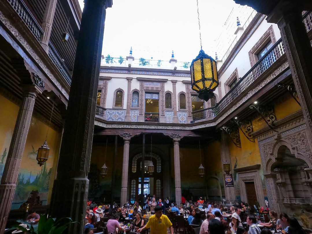 a group of people sitting in a large building