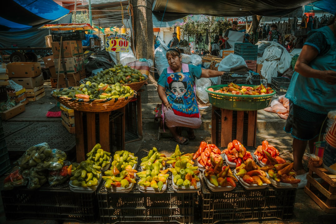 A vendor displays fresh produce at the market.