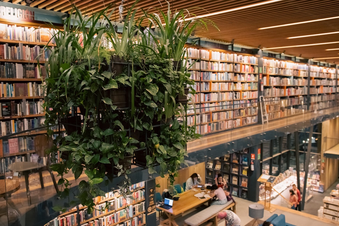 a library filled with lots of books and plants