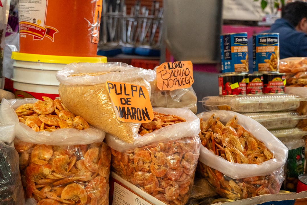 Bags of dried shrimp and other goods at a market.