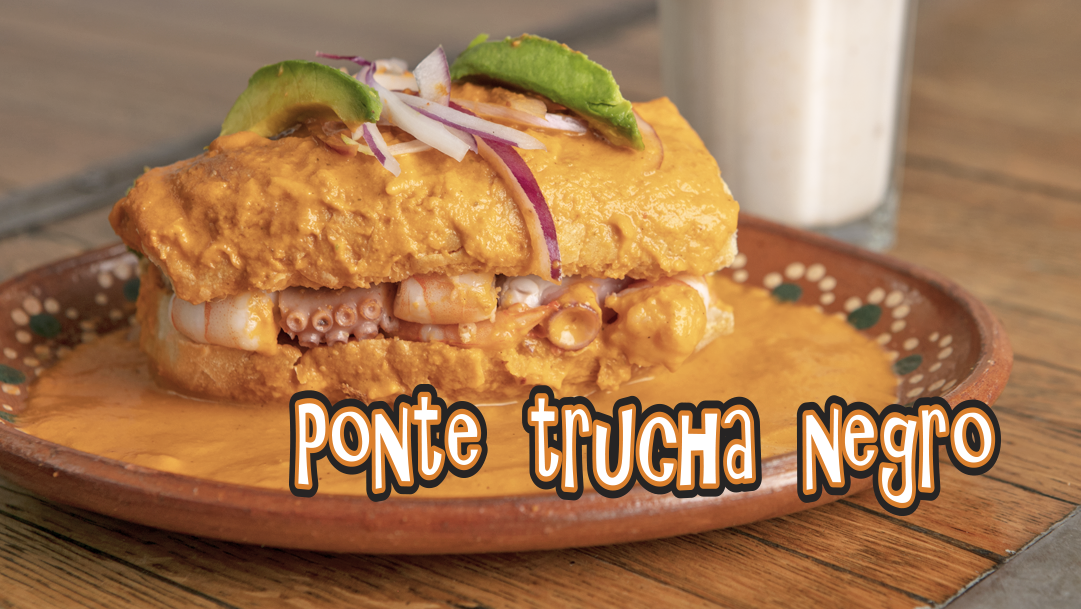 Exterior de La Panga del Impostor con terraza llena de comensales en Col Americana