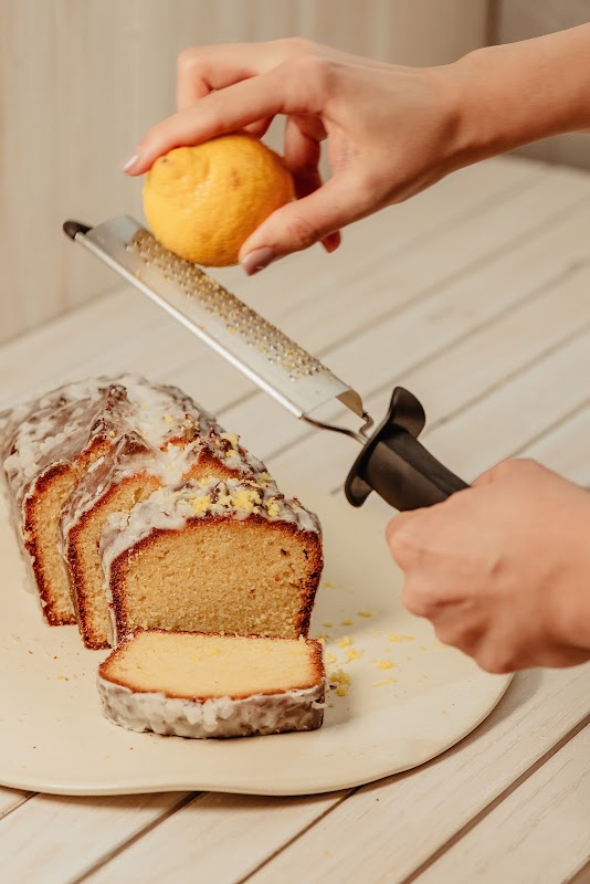 Almaena Restaurante's dining room with white linen tables and hanging lights