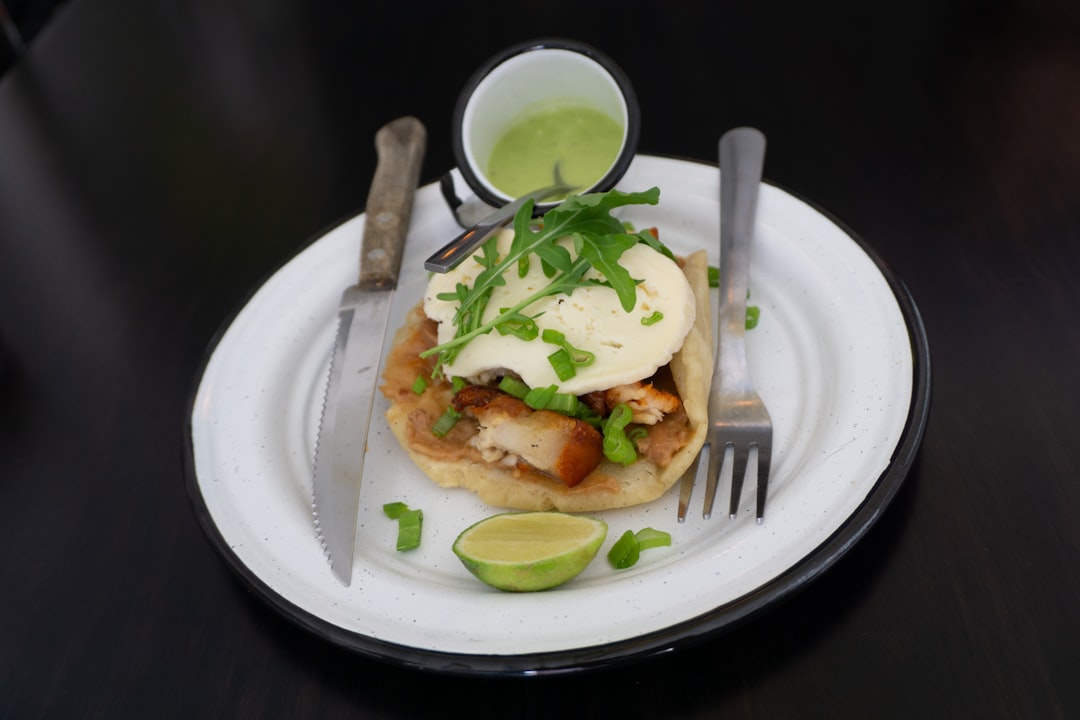 cooked food with fork and knife on plate