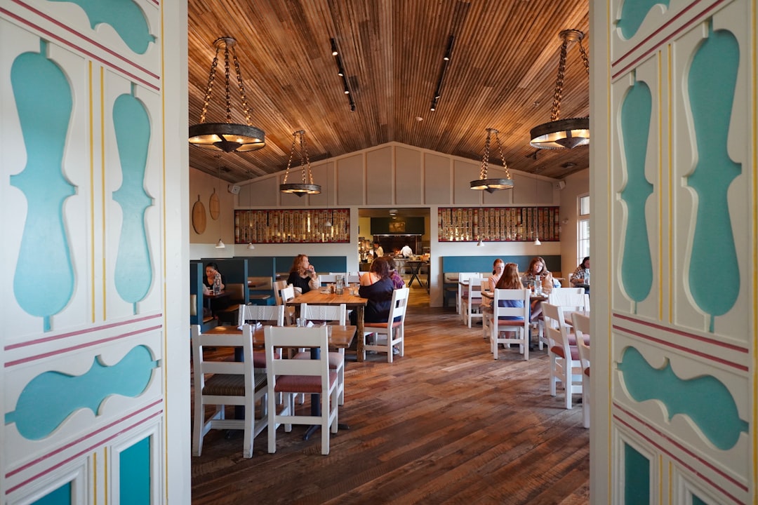 A view of a restaurant through an open door