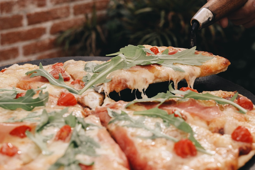 a close up of a pizza on a pan