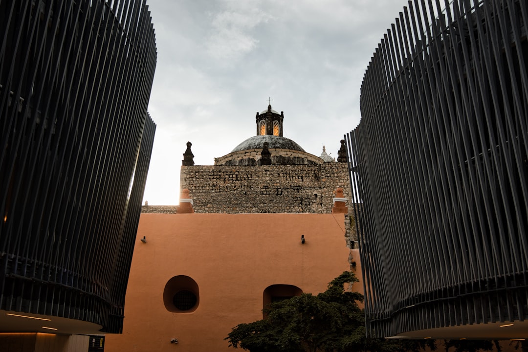 Historic dome structure framed by modern architecture