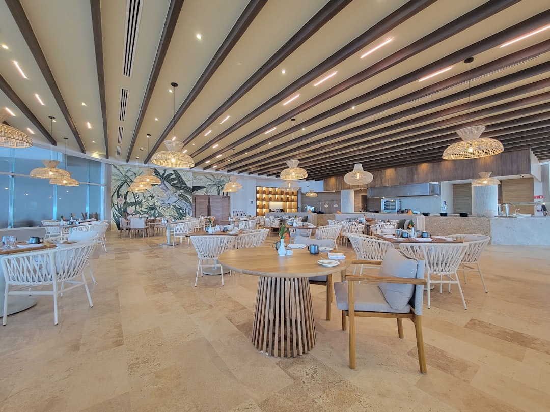 A large room with tables and chairs and lights