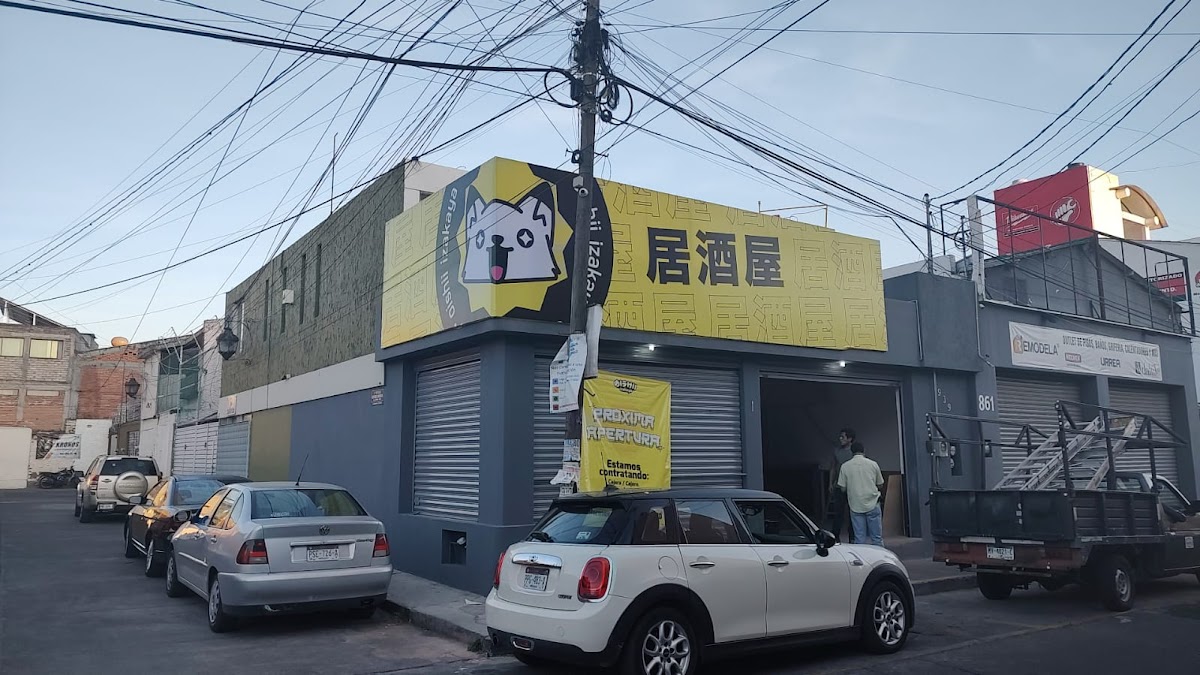 Exterior of Magari Cafetería Japonesa on Mariano Elizaga, showing its bright signage and a glimpse of the karaoke area inside