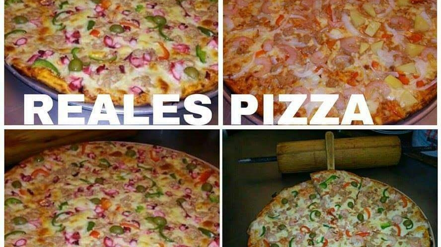 Primer plano de la Margherita de la Casa en Andiamo Pizzas Camelinas, mostrando la mozzarella fundida y albahaca fresca