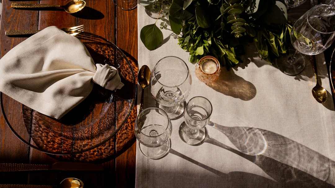 A table topped with a plate of food next to a knife and fork