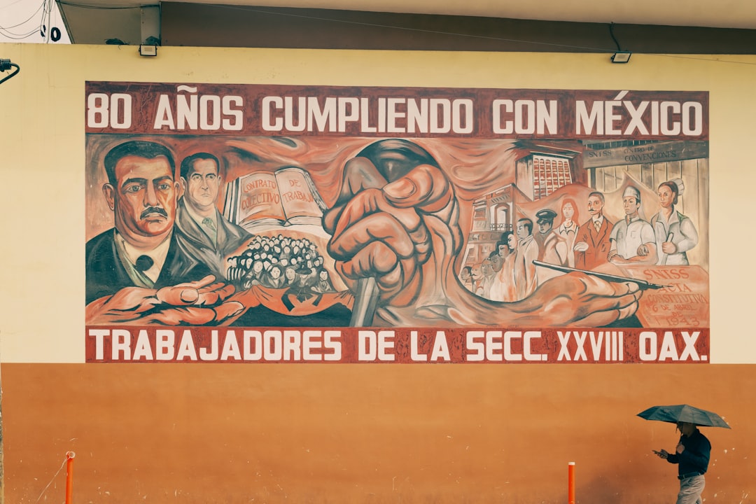 Mural depicting workers and a clenched fist