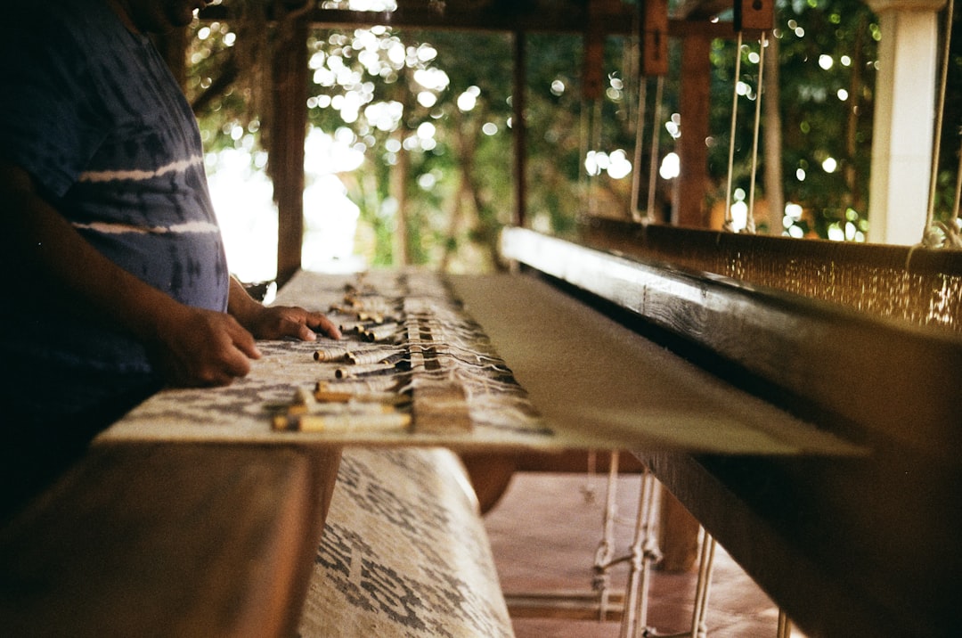 a man playing a game of checkers on a long table