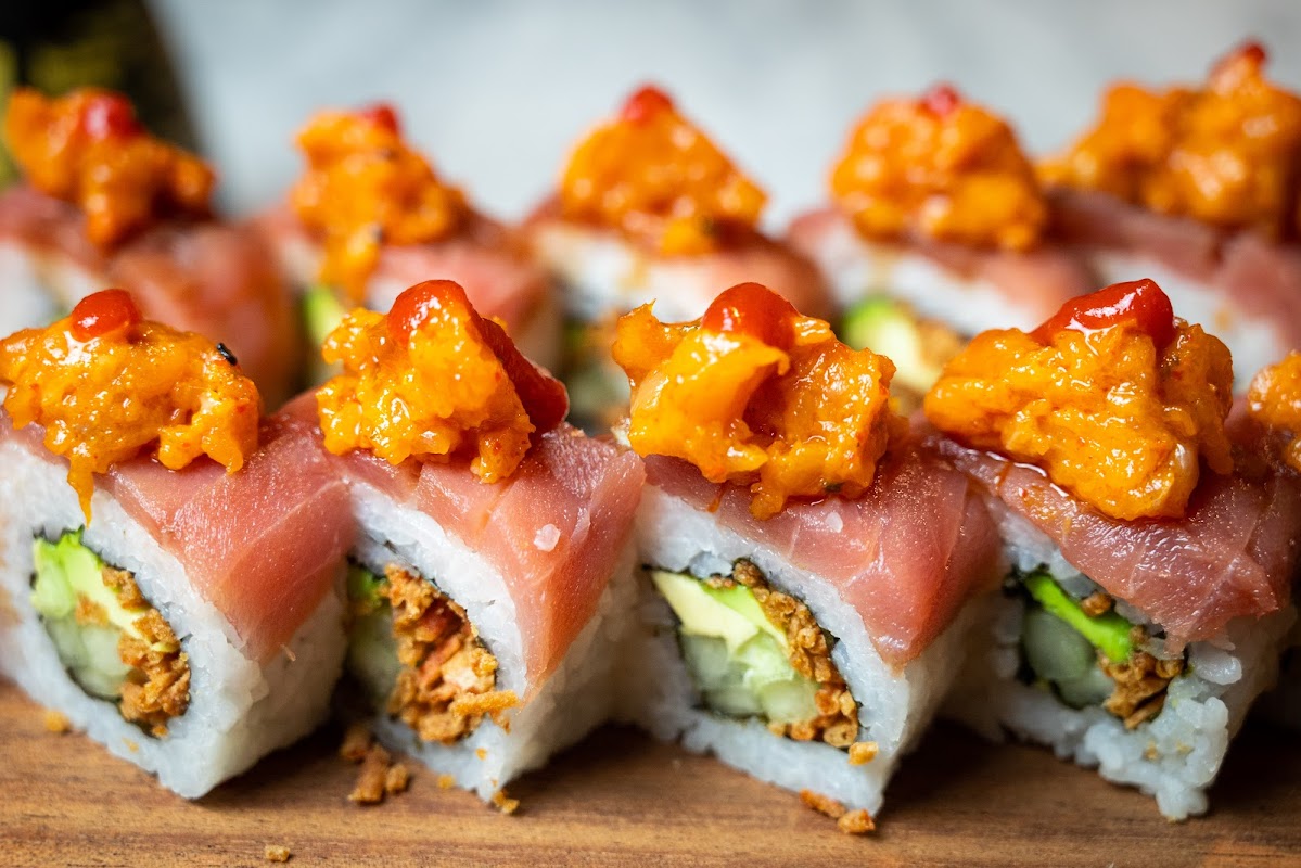 UMI SAMA SUSHI BAR's glowing interior showcases fresh seafood and modern Japanese decor