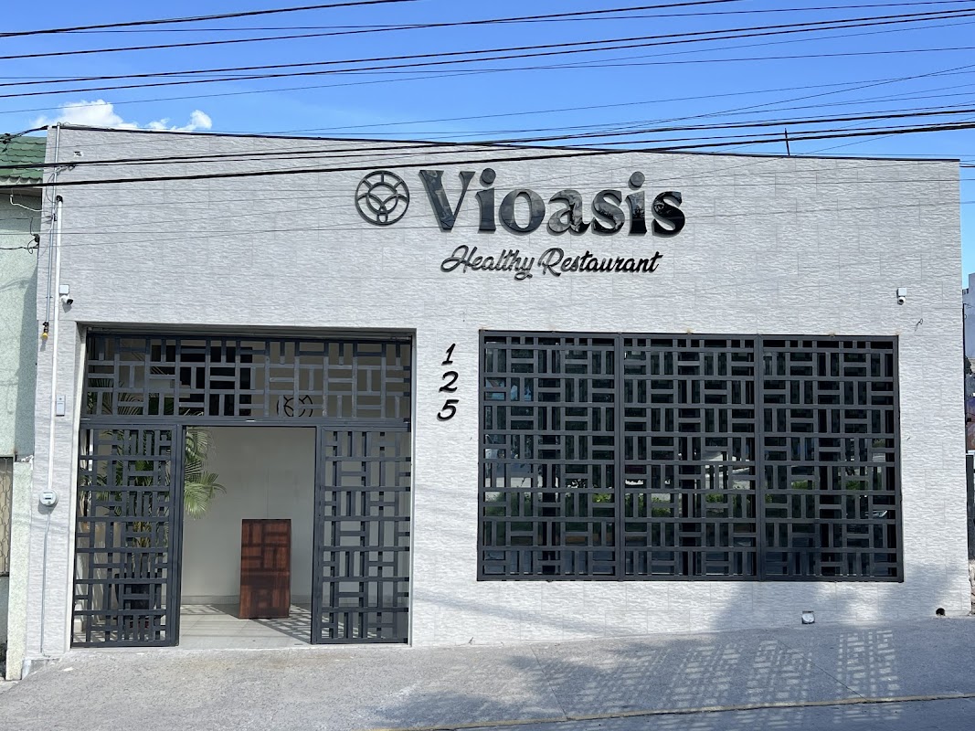 Chicken Panini at Vioasis Healthy Restaurant, showing the toasted whole‑grain bread, sliced avocado and fresh greens.
