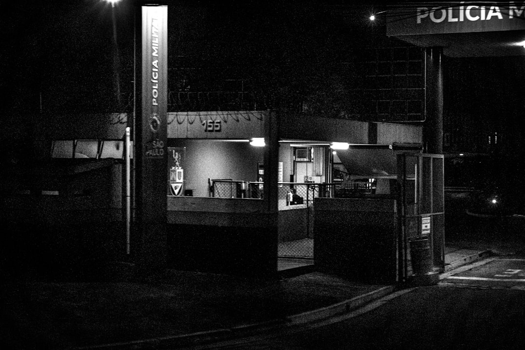 Police station entrance at night with lights on