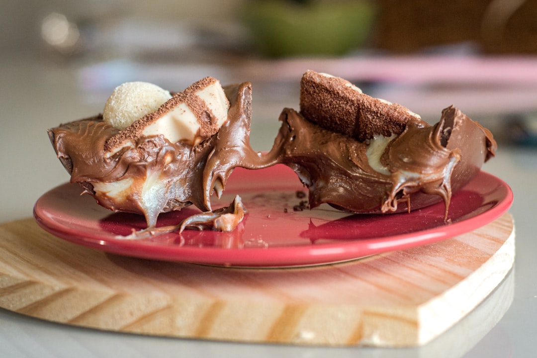 a piece of cake on a red plate on a table