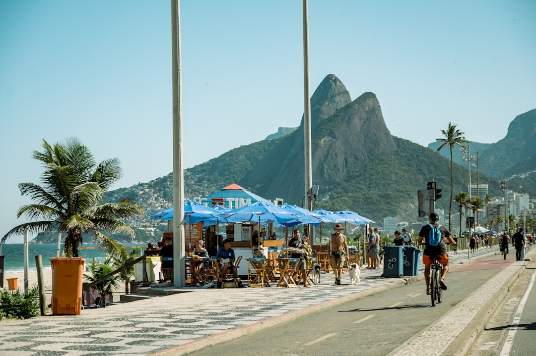 A group of people riding bikes down a street