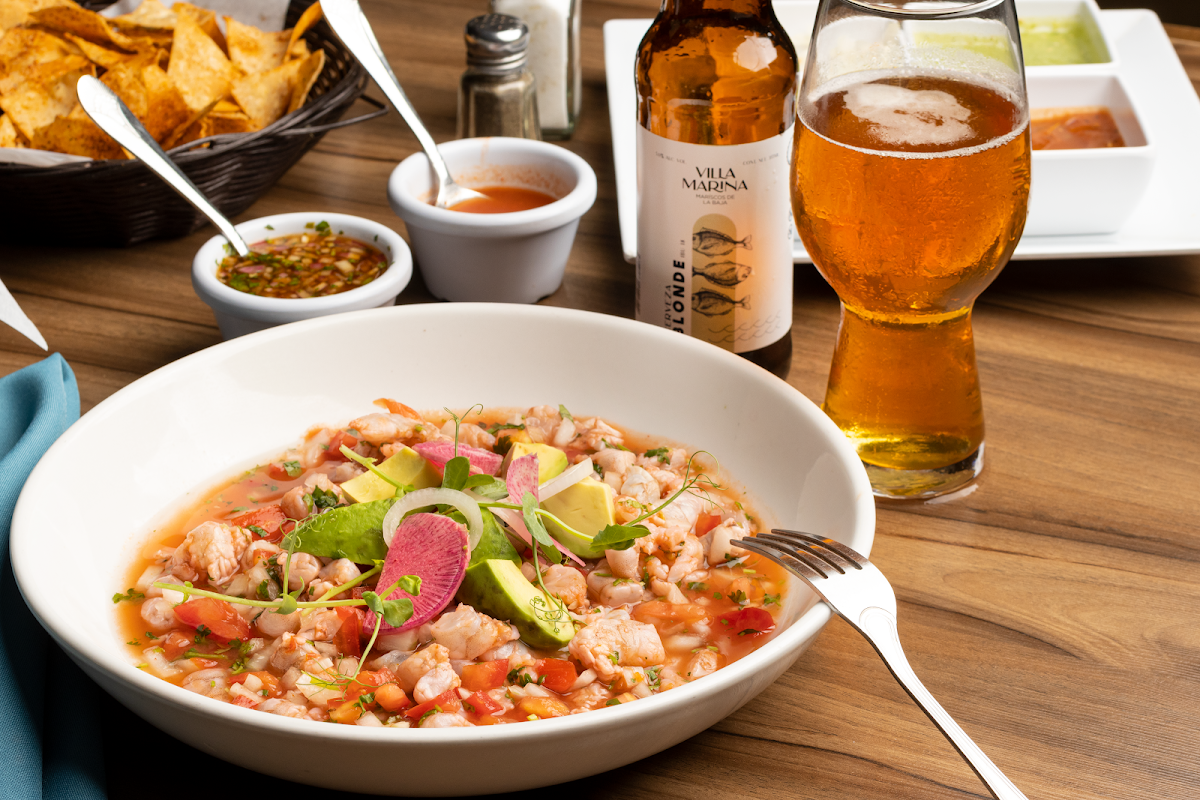 Villa Marina Restaurante Tijuana interior with bar and a platter of ceviche on the table
