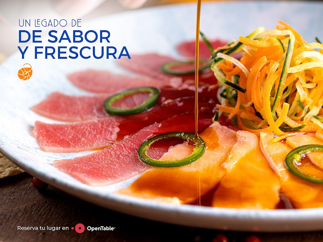 Los Arcos Restaurant's ceviche and octopus platter under oceanic blue lighting