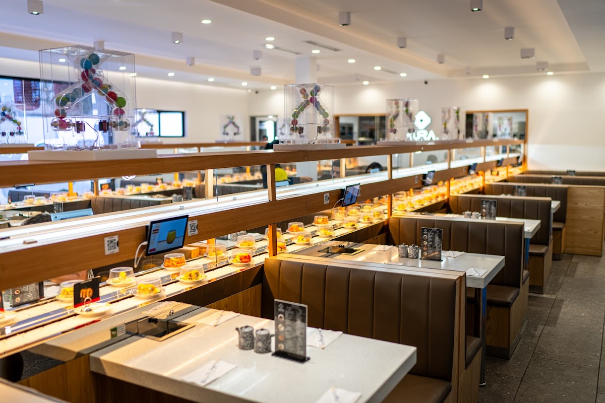 Sawa Sushi Tijuana – exterior storefront on Central 12735 with neon signage, and a close‑up of their signature toro nigiri on a wooden plate