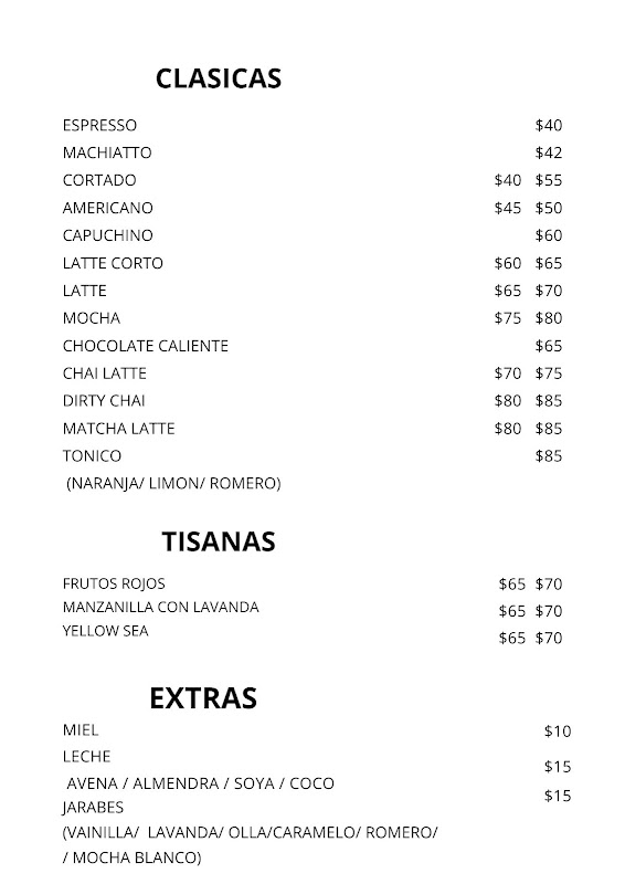 Corteza Madre storefront on Miguel Alemán Valdez at sunrise, chalkboard menu visible and early patrons seated