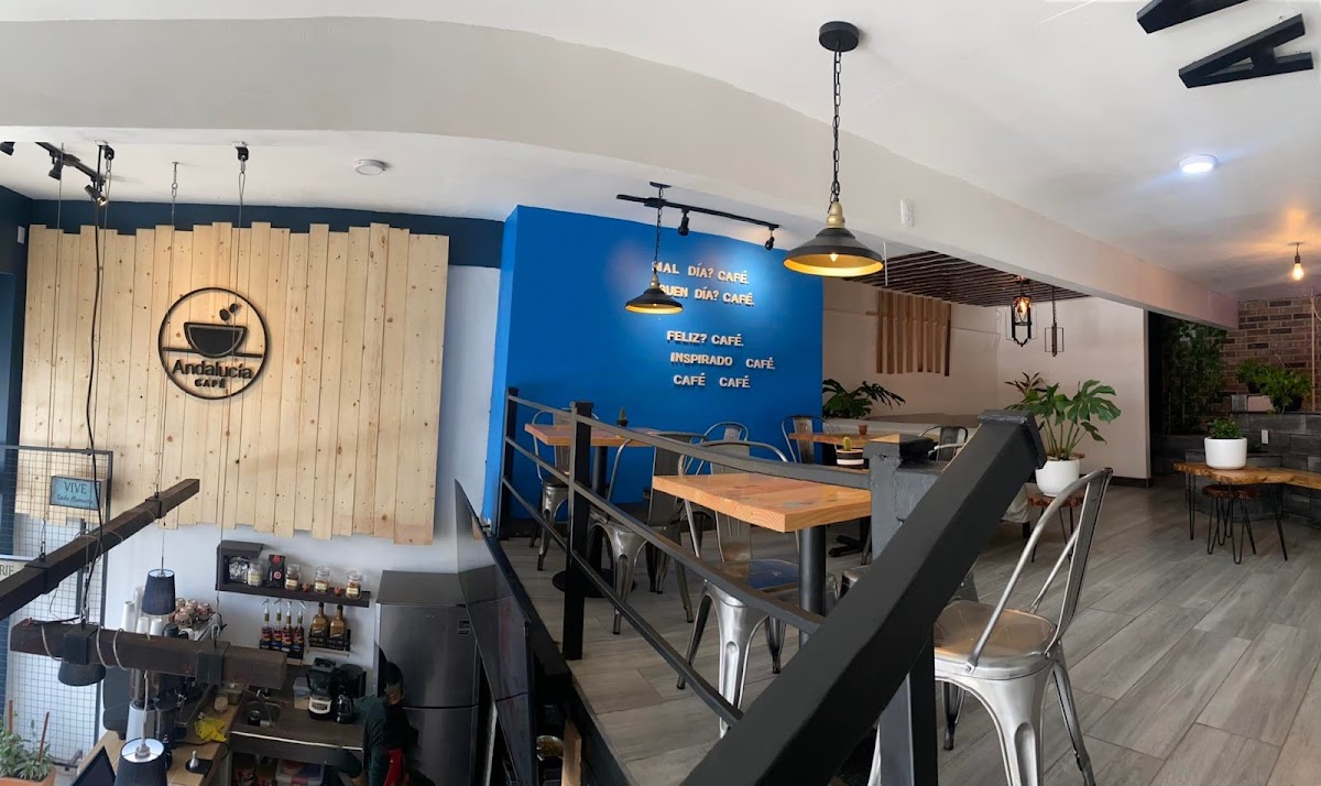 Sushi Factory's sushi bar with chefs arranging fresh nigiri, bright lighting, and colorful plates